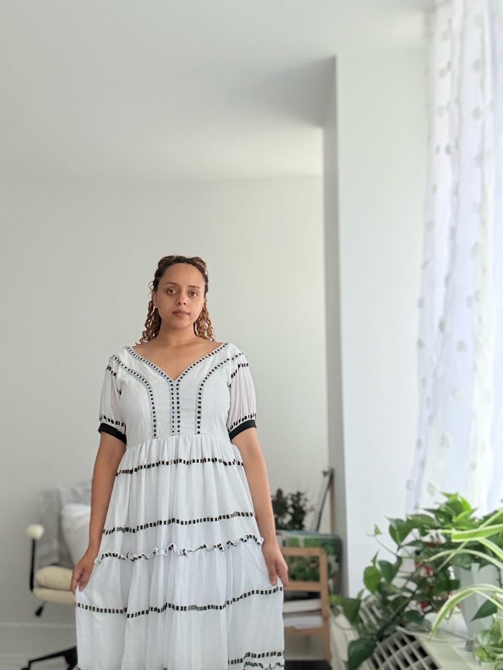 Oromo cultural dress 
White Tiered V-Neck Dress with Black Trim